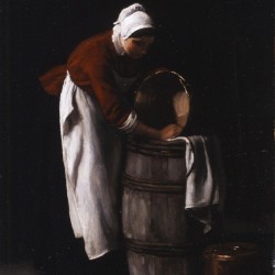 A woman cleaning a barrel